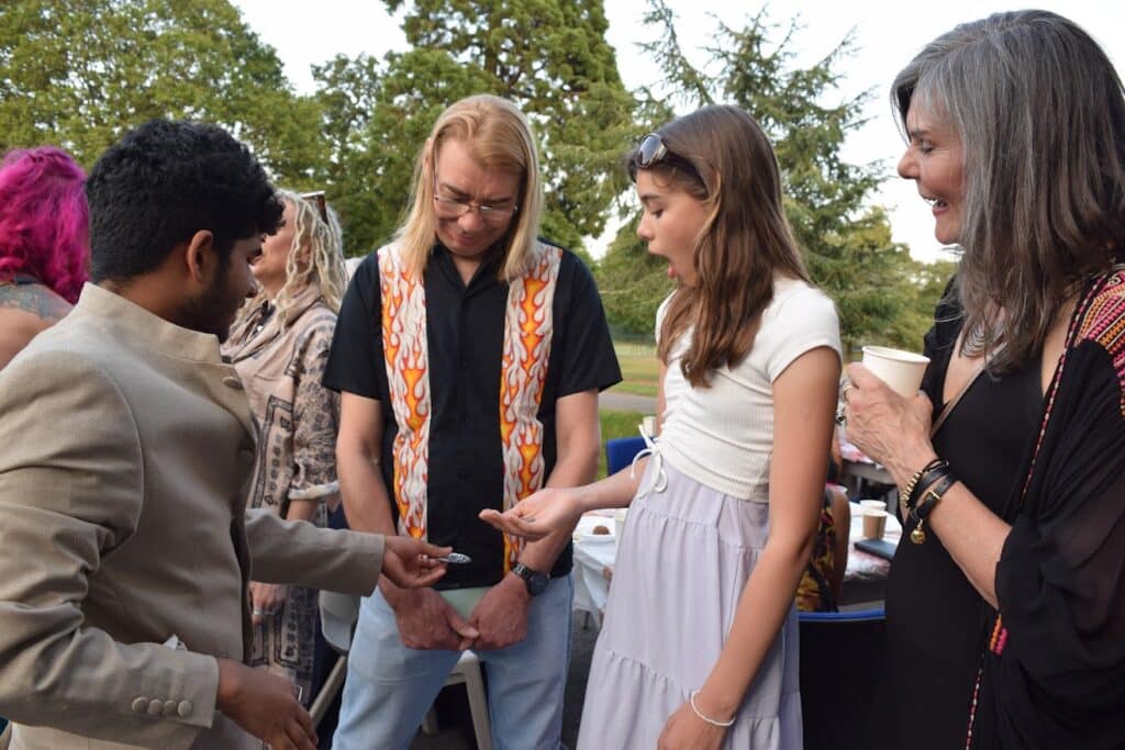 Interactive party magic show creating laughter and reactions at a cambridge celebration